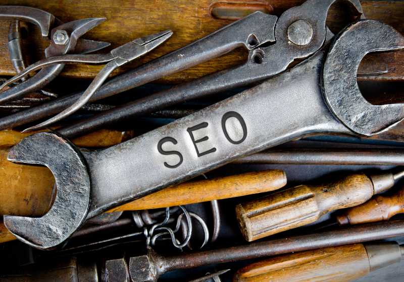 Photo Of Various Tools And Instruments With Seo Letters Imprinted On A Clear Wrench Surface | Seo Tools